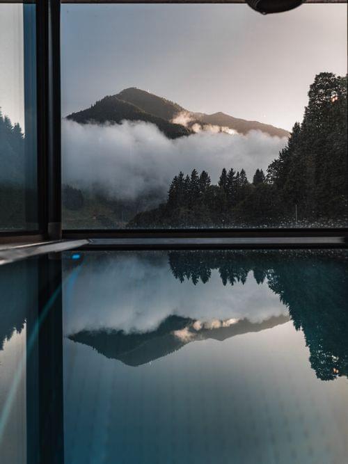 A swimming pool with a view of the mountains.