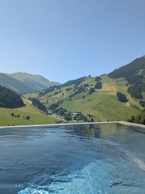 An infinity pool with a view of the mountains.