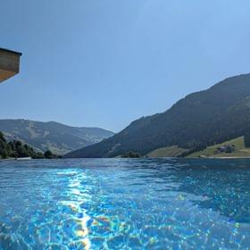 The bathhouse with the infinity pool in summer.