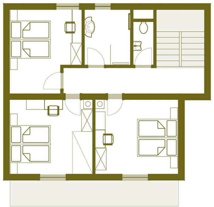 Grundriss einer Dreizimmerwohnung mit zwei Bädern und Treppenzugang