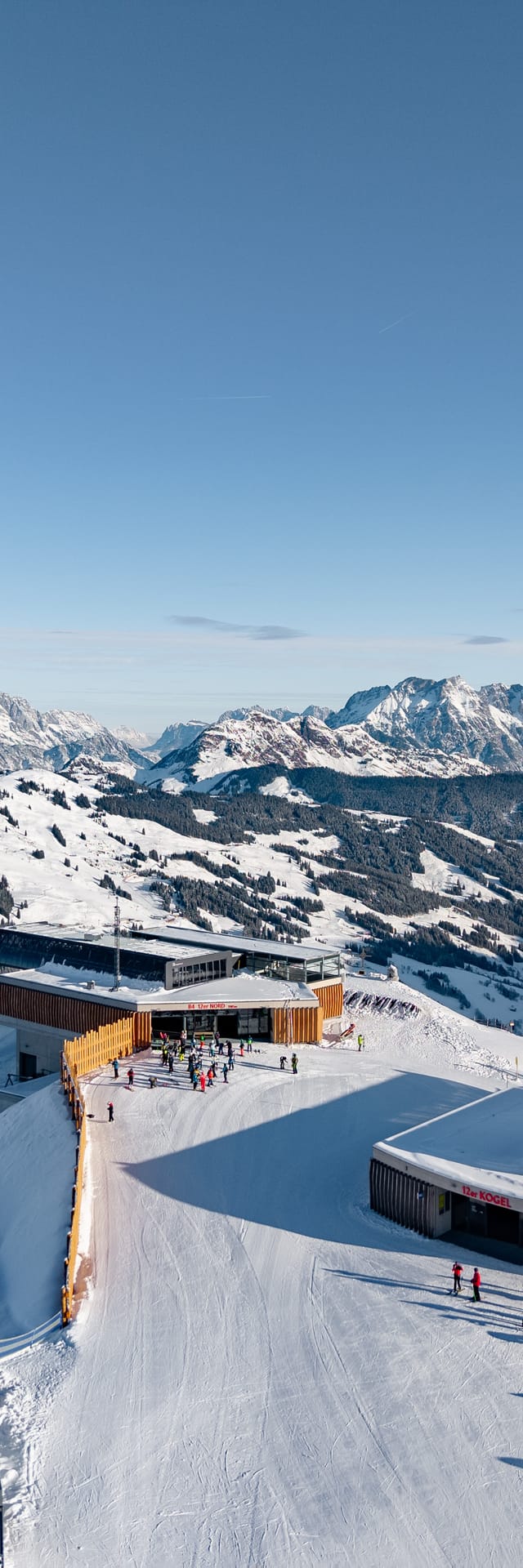 A bird’s-eye view of the Zwölferkogel and the surrounding mountain landscape in winter.